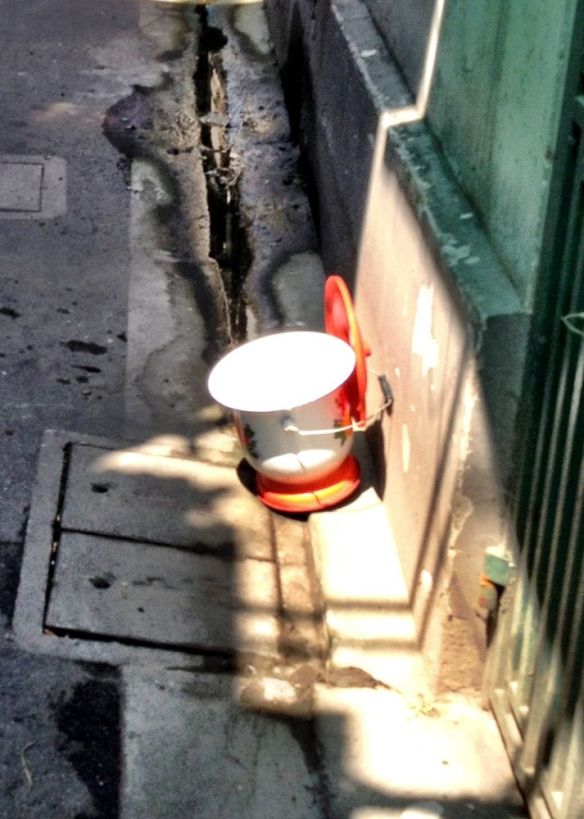 A slop bucket drying in the sun, a reminder of how everyone lived and some still do...but not for long I guess