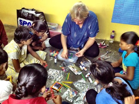 Cindy getting down to work, kids looking on with rapt attention
