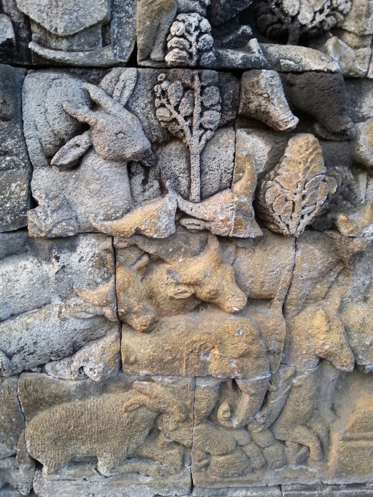 Animals listening to the teachings of Buddha - damaged by an overenthusiastic Dutchman who, in trying to preserve them, managed to corrode them instead.