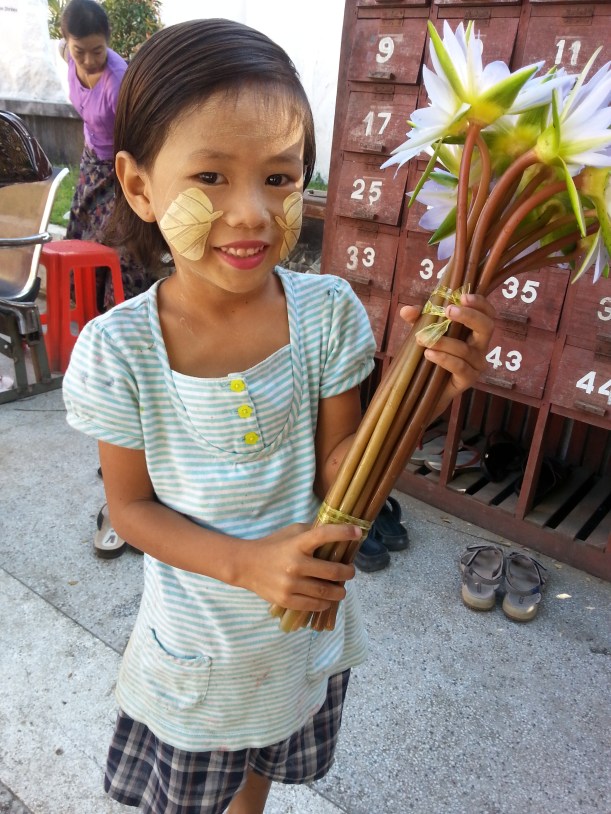 Lotus flower seller outside temple in Mandalay