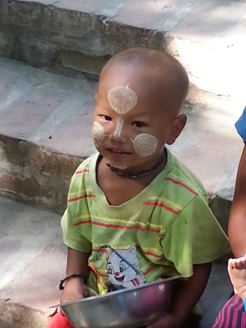 Little boy, waiting with his mother to be fed