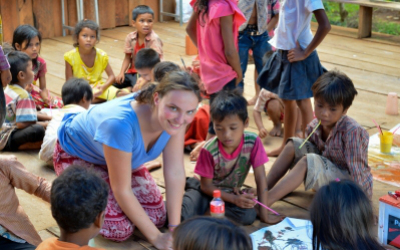 A volunteer from a partner school in a Cambodian school
