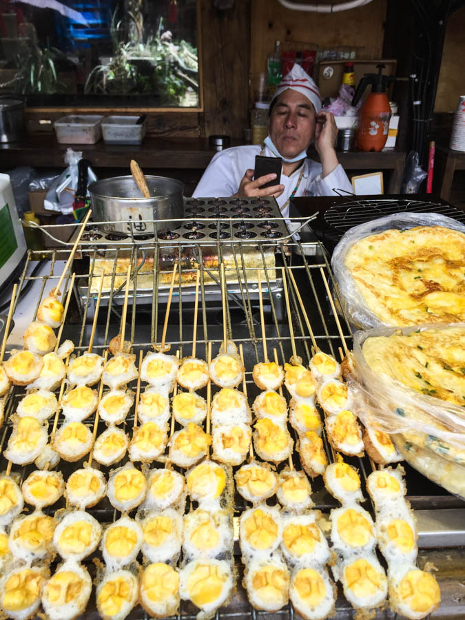 All the street food sellers seem to do is play on their mobile phones...