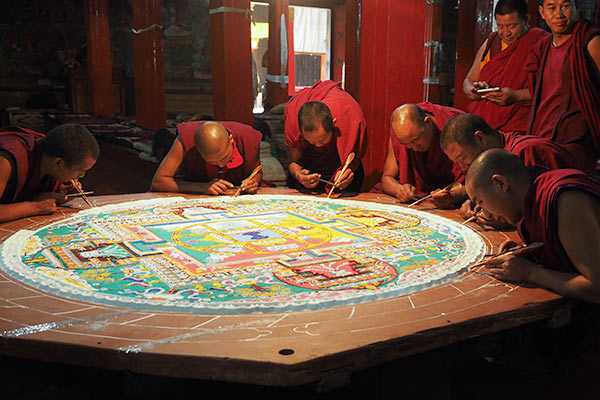 The monks making a mandala from sand (courtesy Ross Cattell)