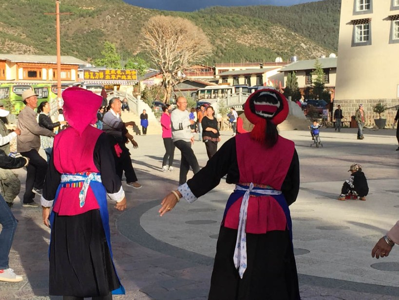 Tibetan ladies dancing in the evening sunlight