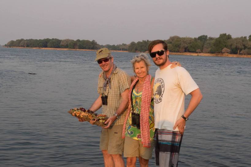 The three of us about teh launch a barque of exquisite flowers into the confluence of the rivers, where we scattered Louise in 2011