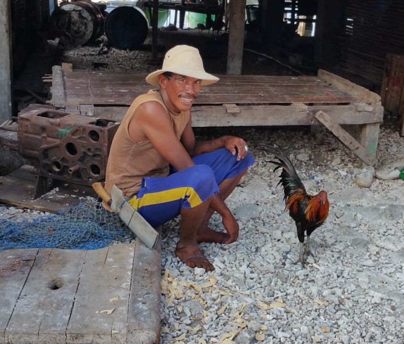 Proud owner of a fighting cock